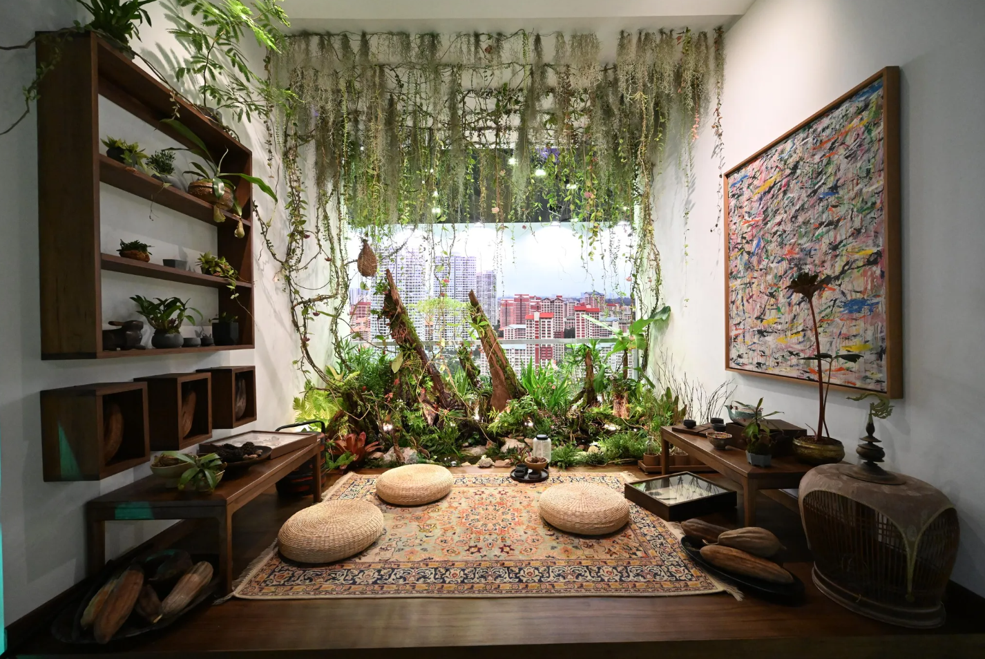 A living space filled with greenery and sitting on the floor